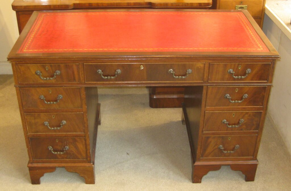 Reproduction mahogany kneehole desk. Dorking Desks