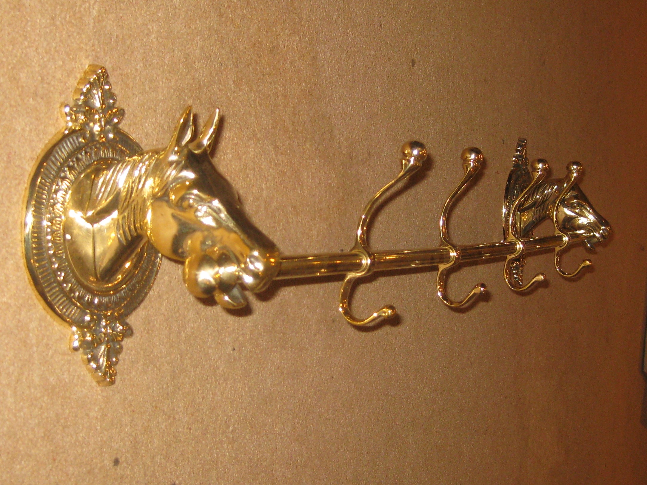 An unusual Circa 1910 'Horse' themed set of brass hat and coat hooks